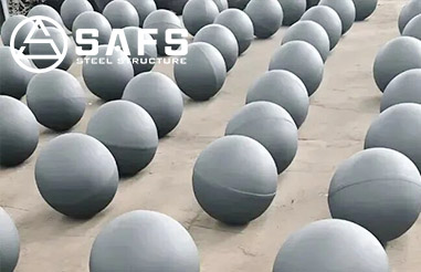 How are welded spherical nodes fabricated in steel space frames?